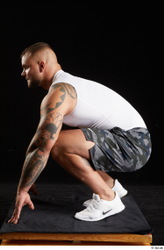 Whole Body Man White Sports Shorts Muscular Kneeling Top Studio photo references